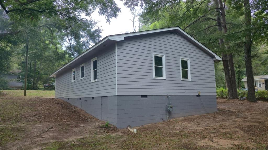 700 New Street Eatonton, GA 31024 - Photo 4 of 19 a view of a house with a yard