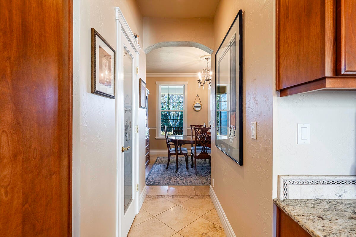 3343 Lone Pine Road Medford, OR 97504 - Photo 27 of 47 Hallway With Walk-In Pantry Connecting The Kitchen & Formal Dining Room