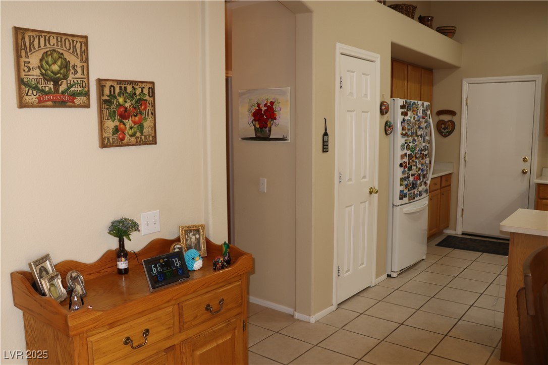 2148 Hidden Ranch Terrace Henderson, NV 89052 - Photo 24 of 31 Hall featuring light tile patterned flooring and baseboards