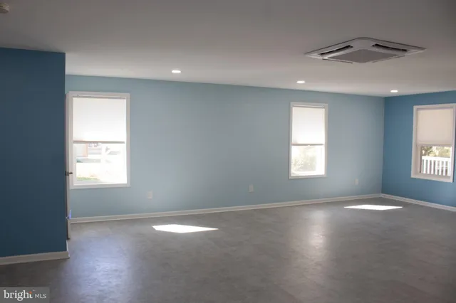 an empty room with windows