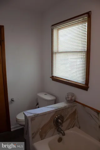 a bathroom with a sink a mirror and vanity