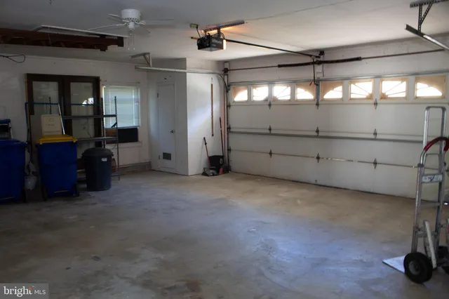a view of a balcony with wooden floor and iron fence