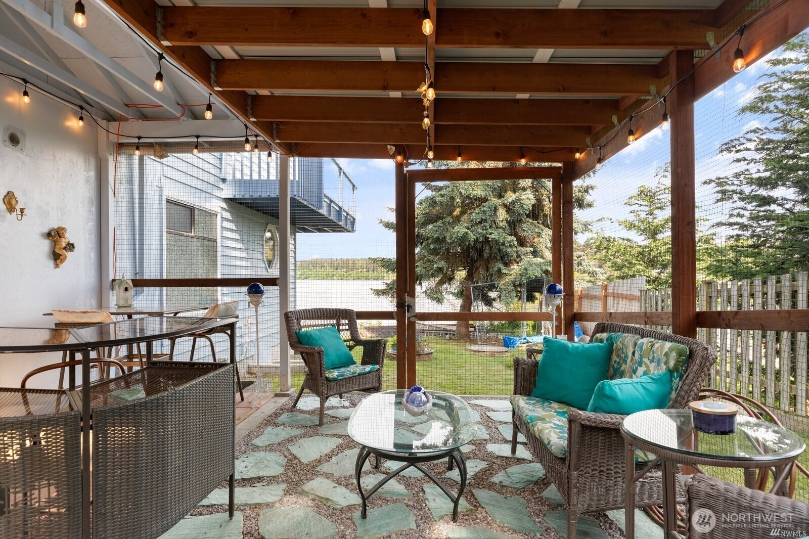 5341 South Bercot Road Freeland, WA 98249 - Photo 28 of 37 a view of a porch with chairs and a yard