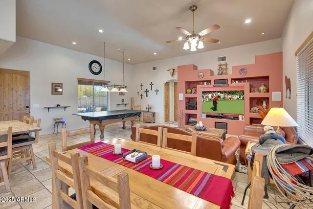 a living room with fireplace furniture and a flat screen tv