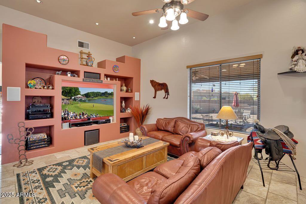 1053 East Maddock Road Phoenix, AZ 85086 - Photo 10 of 60 a living room with fireplace furniture and a flat screen tv