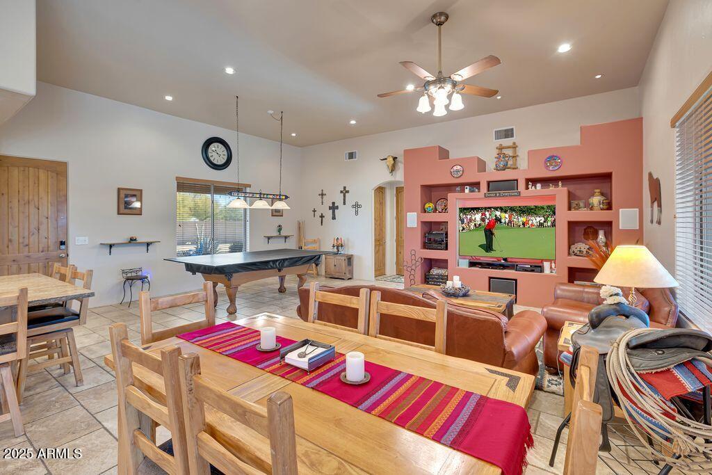 1053 East Maddock Road Phoenix, AZ 85086 - Photo 11 of 60 a living room with lots of furniture and a chandelier