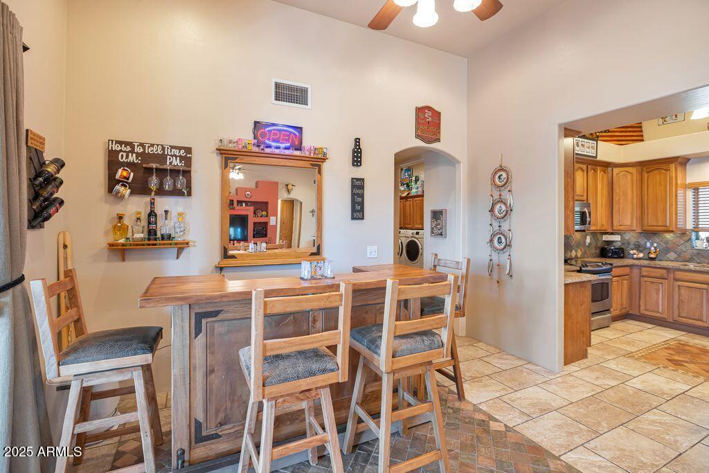 1053 East Maddock Road Phoenix, AZ 85086 - Photo 14 of 60 a view of a dining room with furniture and wooden floor