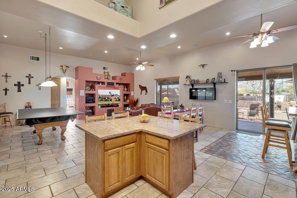 1053 East Maddock Road Phoenix, AZ 85086 - Photo 17 of 60 a kitchen with a sink a counter top space appliances and a view of living room