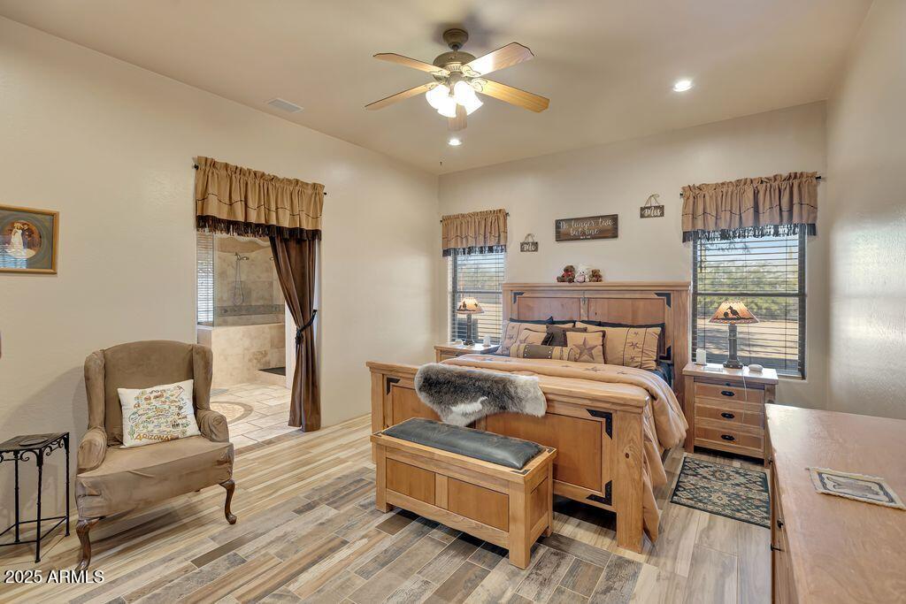 1053 East Maddock Road Phoenix, AZ 85086 - Photo 20 of 60 a bedroom with a bed couch and a view of kitchen