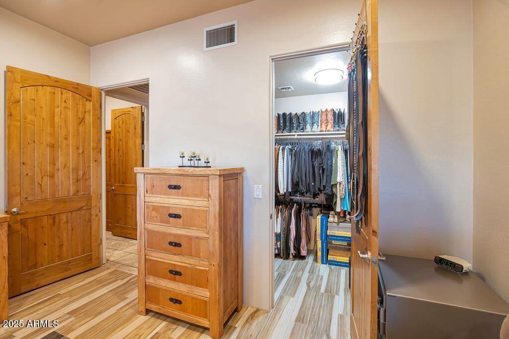 1053 East Maddock Road Phoenix, AZ 85086 - Photo 22 of 60 a view of a walk in closet