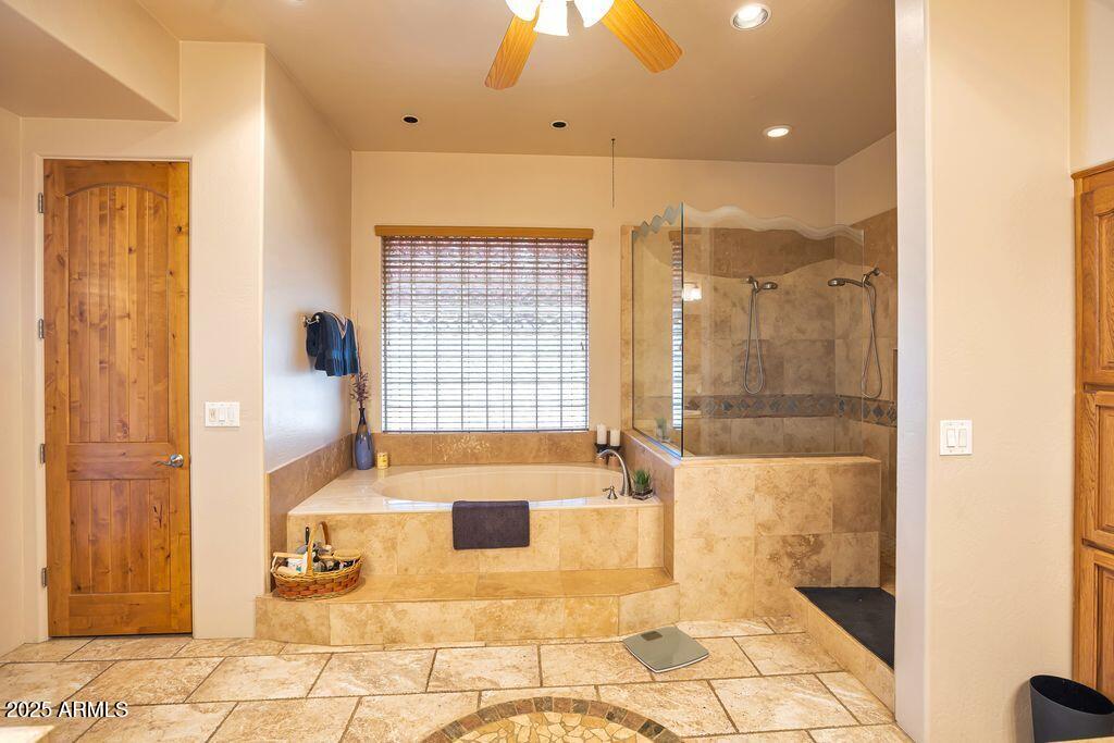 1053 East Maddock Road Phoenix, AZ 85086 - Photo 25 of 60 a bathroom with a bathtub and shower