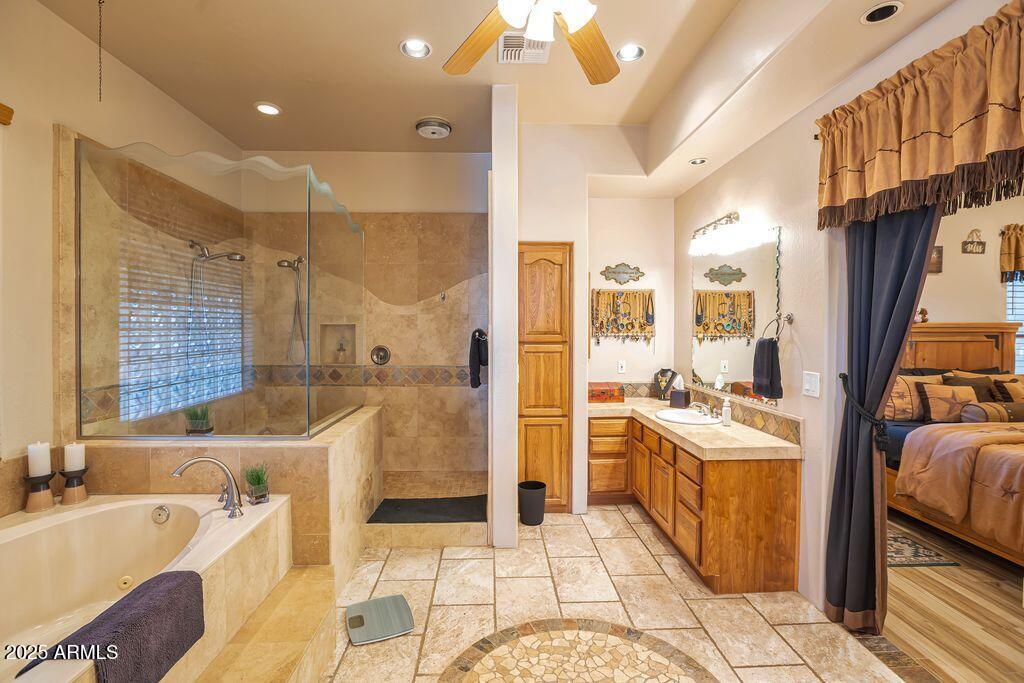 1053 East Maddock Road Phoenix, AZ 85086 - Photo 26 of 60 a large spacious bathroom with a tub sink and mirror