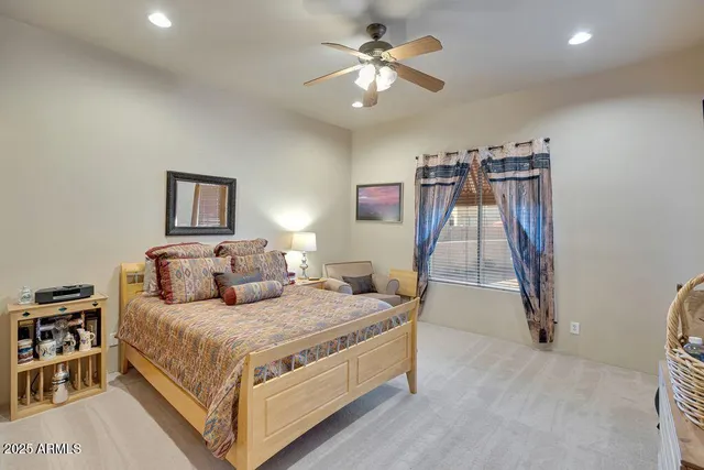 a spacious bathroom with a tub sink and mirror