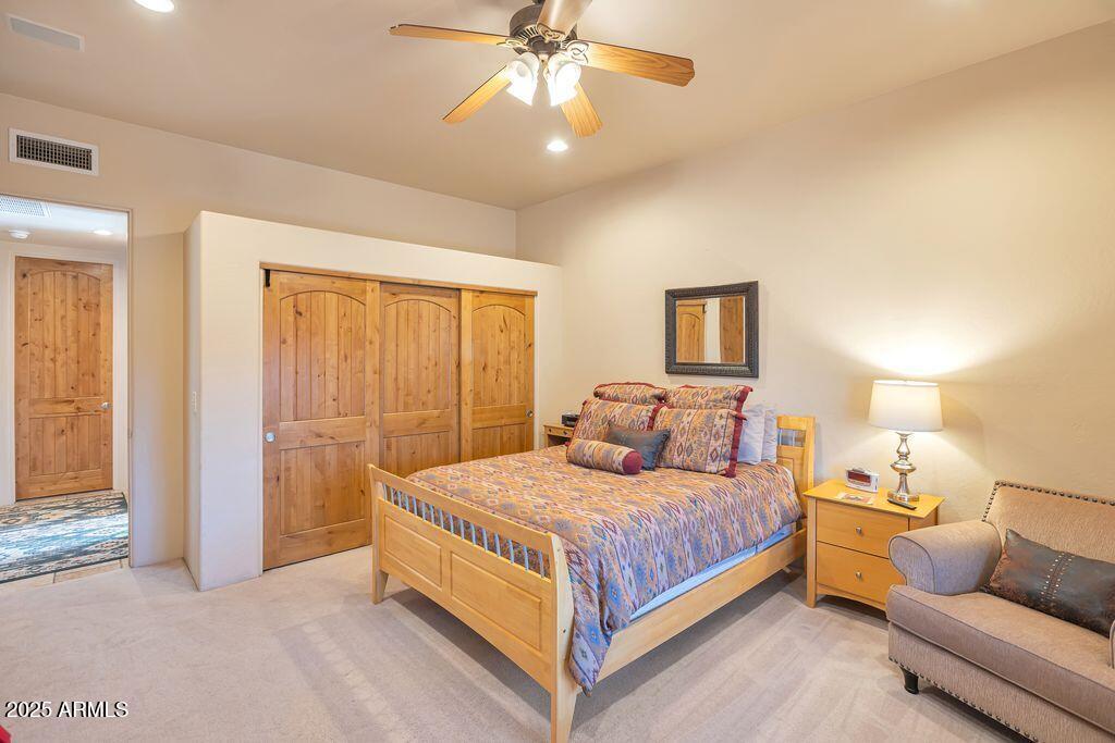 1053 East Maddock Road Phoenix, AZ 85086 - Photo 30 of 60 a bedroom with a bed and a couch