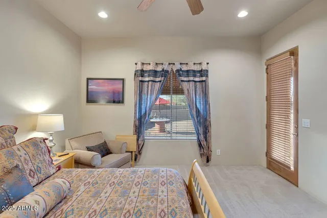 a bedroom with a bed and a couch