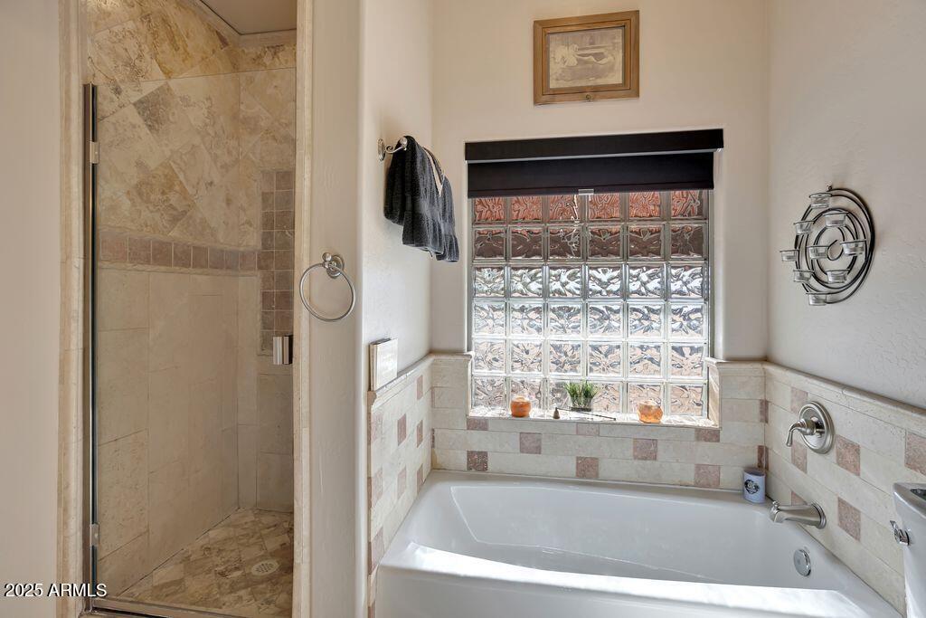 1053 East Maddock Road Phoenix, AZ 85086 - Photo 33 of 60 a bathroom with a bathtub and a shower