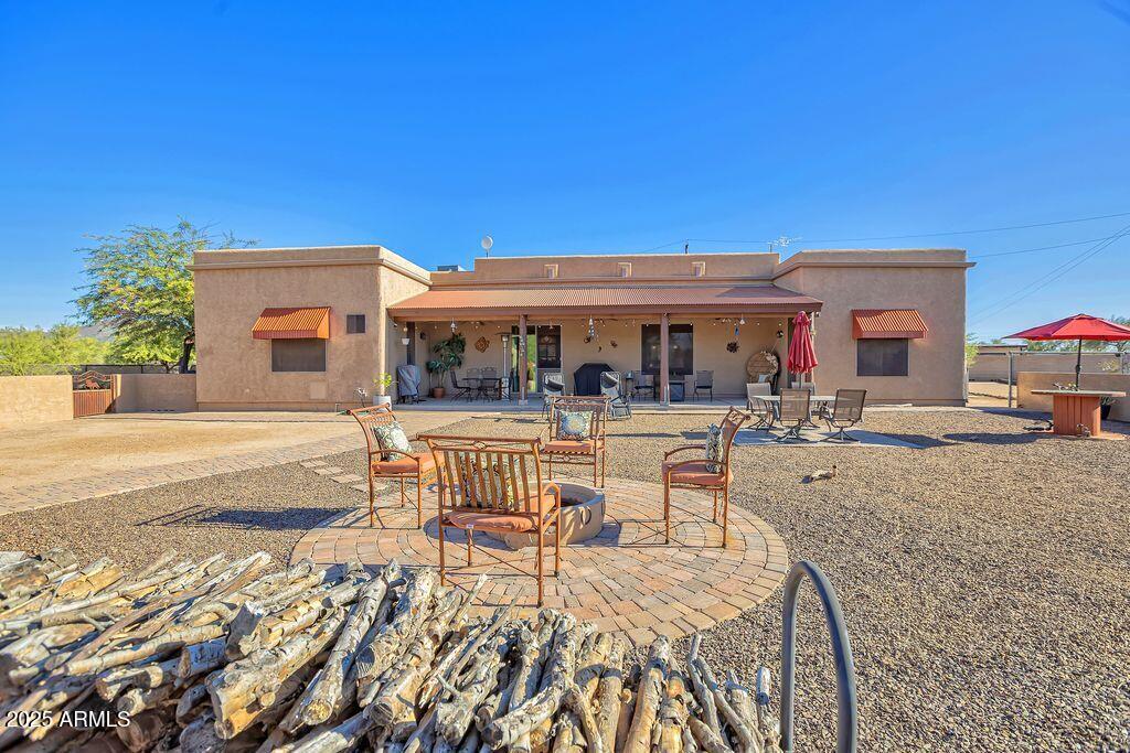 1053 East Maddock Road Phoenix, AZ 85086 - Photo 38 of 60 a view of house with swimming pool outdoor seating and house in the background