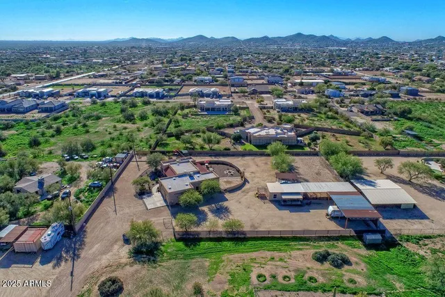 an aerial view of multiple houses with yard