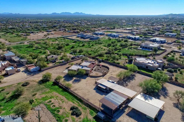 an aerial view of a house with outdoor space