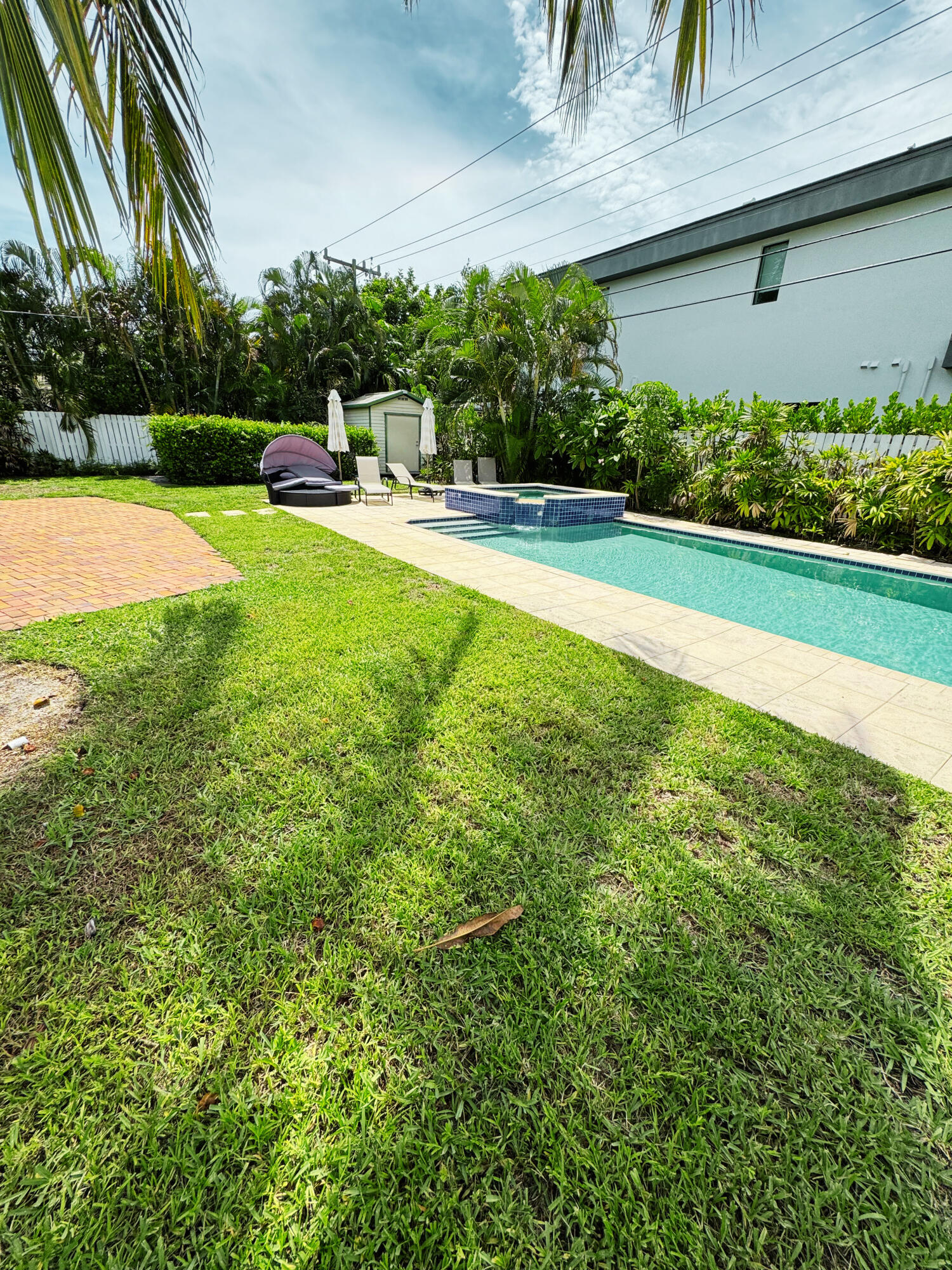 300 Northeast 7th Street Boca Raton, FL 33432 - Photo 15 of 16 a view of a swimming pool with a yard