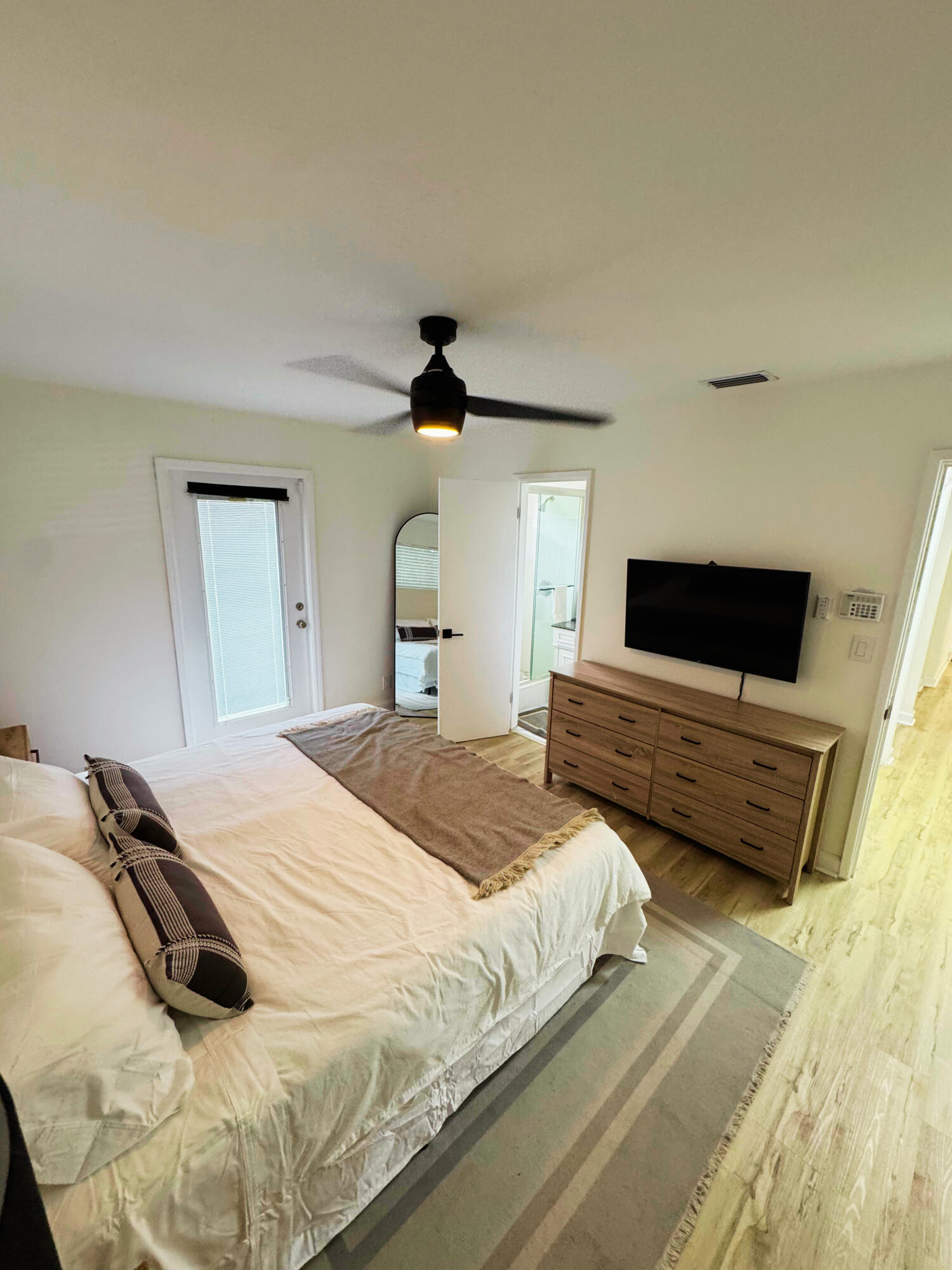 300 Northeast 7th Street Boca Raton, FL 33432 - Photo 6 of 16 a bedroom with a bed and a flat screen tv