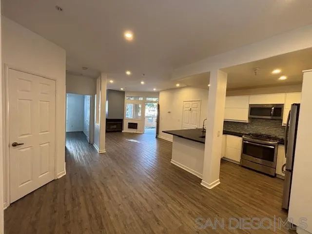 3919 Normal Street San Diego, CA 92103 - Photo 4 of 14 a view of a kitchen with a sink and a stove top oven