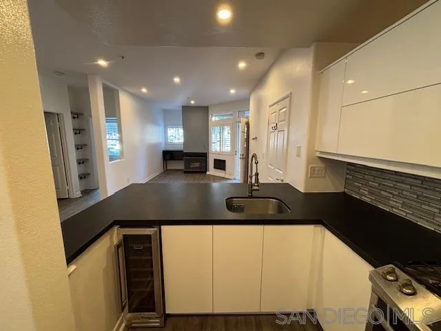 3919 Normal Street San Diego, CA 92103 - Photo 5 of 14 a kitchen with stainless steel appliances granite countertop a sink a stove and a refrigerator