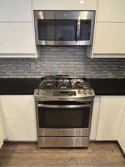 3919 Normal Street San Diego, CA 92103 - Photo 6 of 14 a stove top oven sitting inside of a kitchen