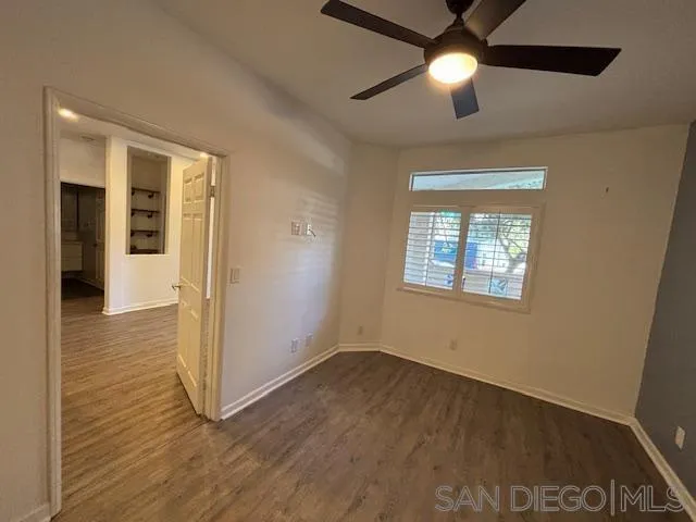 3919 Normal Street San Diego, CA 92103 - Photo 9 of 14 an empty room with wooden floor closet and windows