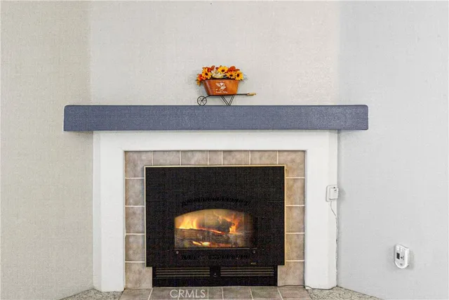 a living room with a fireplace and a couch