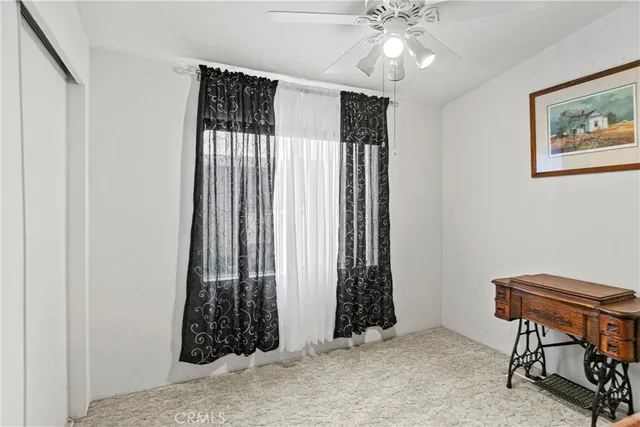 a view of room with stairs and furniture