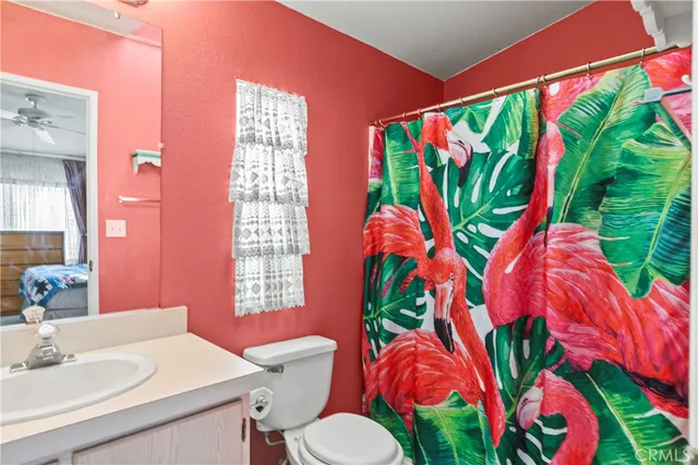 a bathroom with a sink a mirror and a toilet