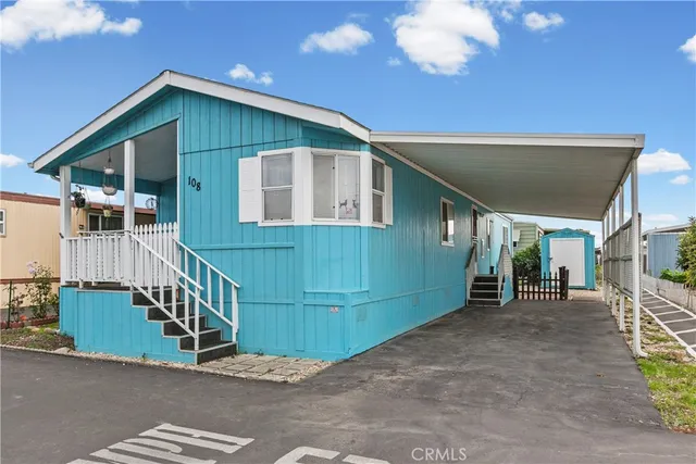 a view of a porch with wooden fence