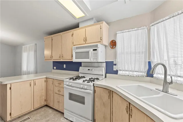 a kitchen with a sink and a window