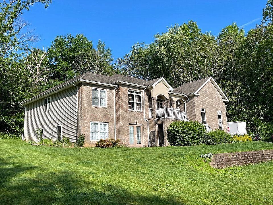 2432 Fadley Road Bridgewater, VA 22812 - Photo 1 of 1 a front view of a house with a garden