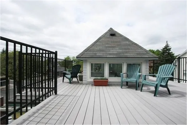 a view of a house with sitting area and wooden floor