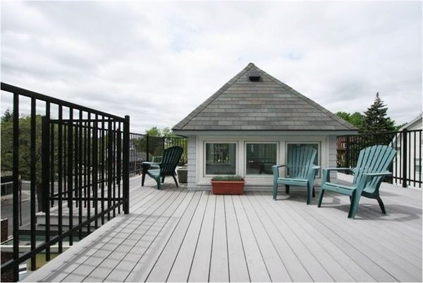 a view of a house with sitting area and wooden floor