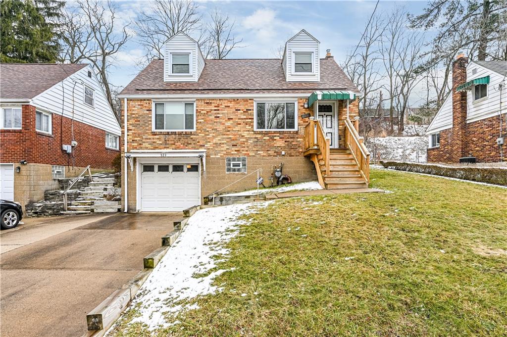 523 Beulah Road Pittsburgh, PA 15235 - Photo 1 of 36 a view of a house with a yard and garage