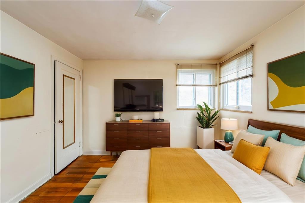 523 Beulah Road Pittsburgh, PA 15235 - Photo 14 of 36 a bedroom with a bed and a flat screen television