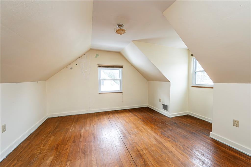 523 Beulah Road Pittsburgh, PA 15235 - Photo 18 of 36 an empty room with wooden floor and windows