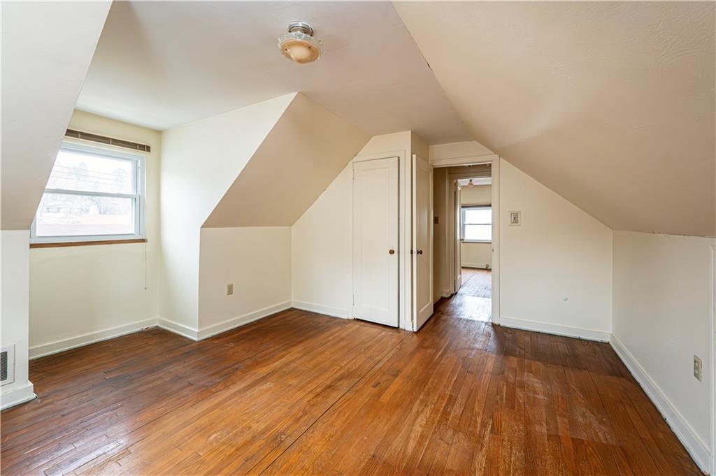 523 Beulah Road Pittsburgh, PA 15235 - Photo 20 of 36 an empty room with wooden floor and windows