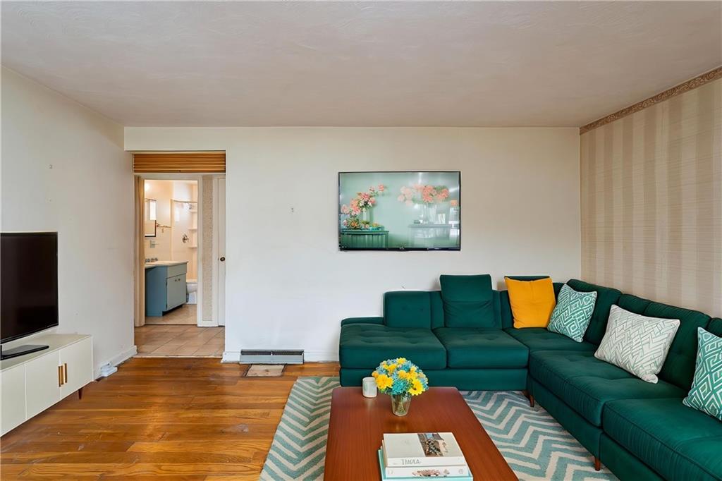 523 Beulah Road Pittsburgh, PA 15235 - Photo 3 of 36 a living room with furniture and a flat screen tv