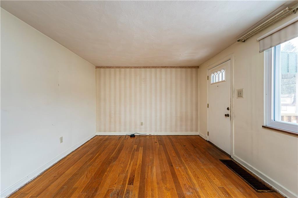 523 Beulah Road Pittsburgh, PA 15235 - Photo 5 of 36 a view of a room with wooden floor and window
