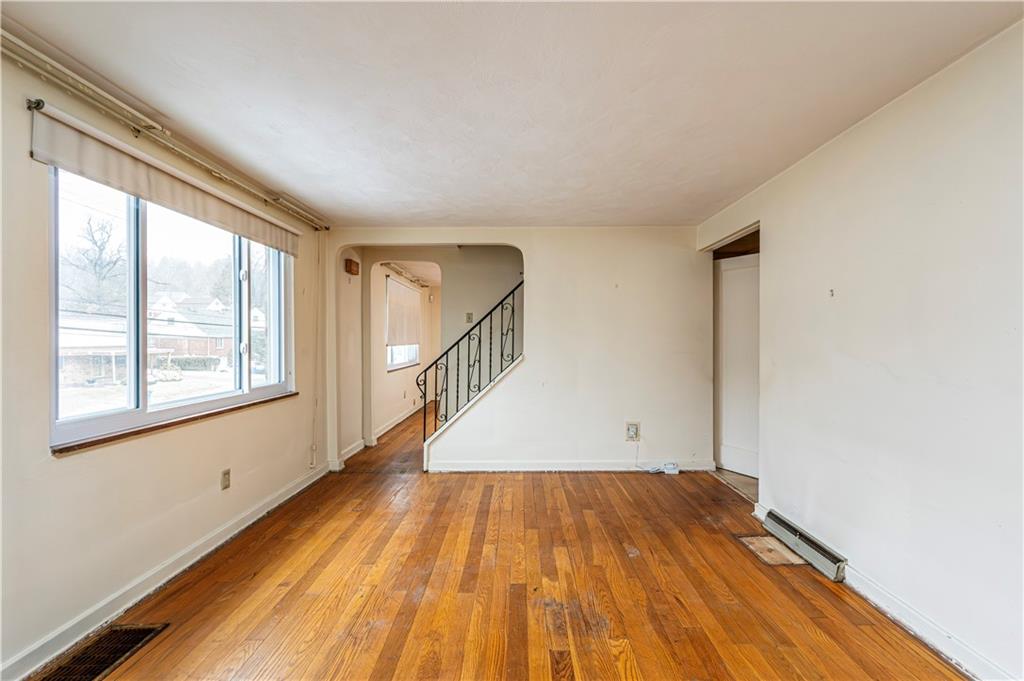 523 Beulah Road Pittsburgh, PA 15235 - Photo 6 of 36 a view of a room with wooden floor and staircase