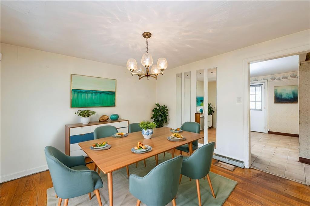 523 Beulah Road Pittsburgh, PA 15235 - Photo 8 of 36 a view of a dining room with furniture and wooden floor