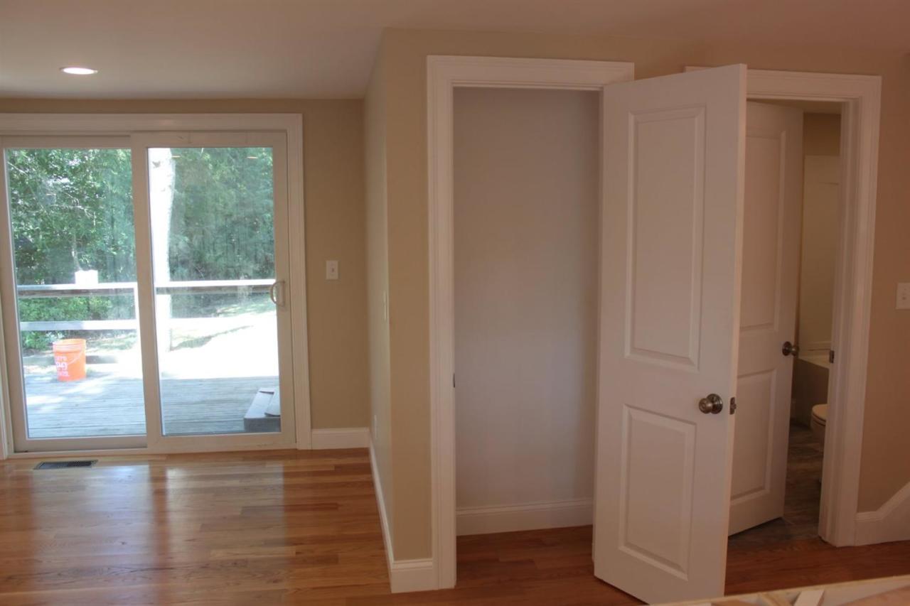 35 Oreo Lane Centerville, MA 02632 - Photo 5 of 11 a view of empty room with wooden floor and fan