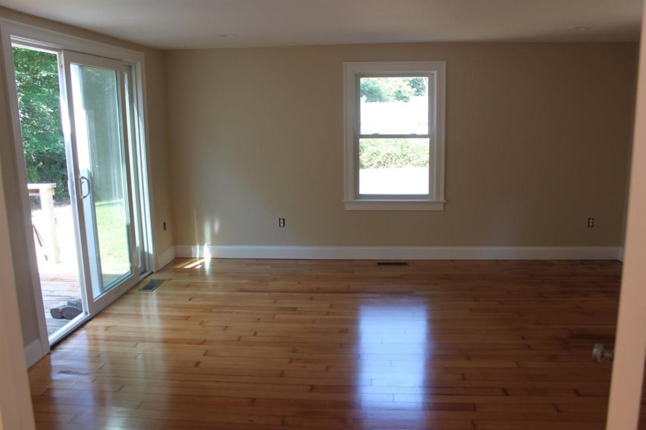 35 Oreo Lane Centerville, MA 02632 - Photo 10 of 11 a view of an empty room with wooden floor and a window