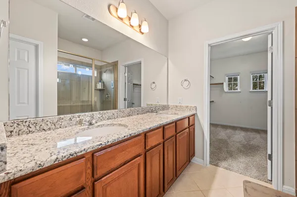 a bathroom with a shower and a tub