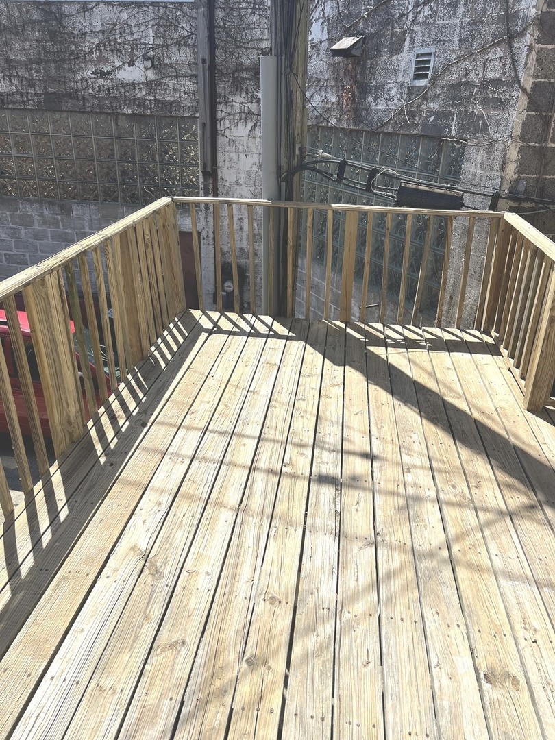 8 North State Street Elgin, IL 60123 - Photo 9 of 9 a view of balcony with wooden floor
