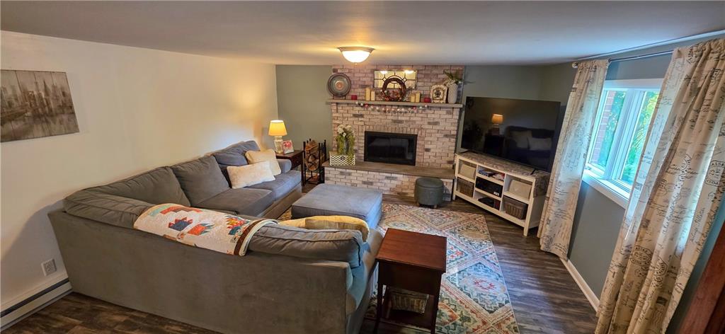 532 Strope Road Burgettstown, PA 15021 - Photo 14 of 20 a living room with furniture a fireplace and a flat screen tv